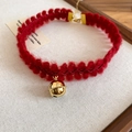 Elegant deep red knitted choker necklace with a gold planetary bell pendant and adjustable chain - Bell Pendant Style / Red
