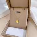 Detailed view of a gold cat head pendant necklace inside a premium jewelry box - Gold (Q517)