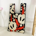 Close-up of knit tote bag with abstract jacquard floral pattern and soft woven texture - Beige Tulip Bag