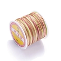 Macro shot of spool of 72# multicolored gradient nylon thread for jewelry braiding - Color No. 15