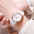 Close-up of minimalist women's watch with white silicone strap and date display on wrist - White