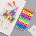 Colorful multi-functional creative pencils arranged on an open book and card - 2707 Stackable Pencils (4 Pcs)