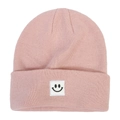 Close-up of pink knitted beanie featuring a white square patch with a black smiley face - Light Skin Red