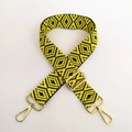 Close-up of yellow and black geometric jacquard bag strap with gold metal buckles - Silver Clasp / Yellow