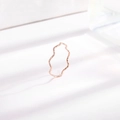 Minimalist wave-shaped titanium steel ring in rose gold finish on white background - US 5 / Rose Gold