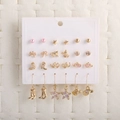 Set of 18 golden and pink bow heart star earrings displayed on a white card background - Pearl Star Butterfly Boot 12 Pairs Earring Set