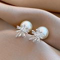 Detailed macro view of large white pearl earrings with sparkling floral diamond studs - 33# Silver Multiple Radiative Snowflake Style (HE30401)