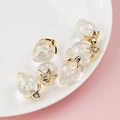 Iridescent glass strawberry charms with gold leaves on a white ceramic tray - Phantom White
