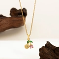 Elegant gold cherry pendant necklace with pink faceted gemstone and green leaf details - Pink Zircon Cherry Necklace Gold