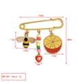 Detailed view of evil eye safety pin brooch with bee and fruit charms including measurements - Bee Lemon Style (BE1729OR00)