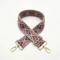 Close-up of ethnic woven strap with purple geometric pattern and gold metal hooks - S13 Purple