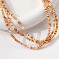 Multi-strand natural shell beaded necklace in earthy beige brown and orange tones - 1 Piece / Khaki