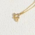 Luxurious gold butterfly pendant necklace with shimmering zircon stones on a white surface - Hollow Butterfly Zirconia 14K Gold
