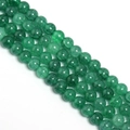 Macro view of emerald green glass beads with crackle texture for DIY jewelry making - Agate Green Floral Round Bead