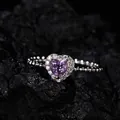 Macro detail of heart-shaped purple amethyst ring with sparkling halo on beaded silver band - Beaded Band Halo Style (LR338)