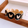 Bracciale vintage elastico con ciondoli a farfalla in smalto nero e finiture dorate - Stile Farfalla Nera
