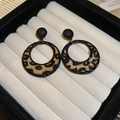 Detail view of round leopard print earrings with black studs in a velvet gift box - 60# Black & Coffee