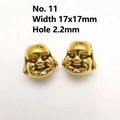 Macro detail of two gold Buddha head beads for DIY jewelry with 17x17mm size and 2.2mm hole - 11# Gold Large Buddha Head (17x17mm)