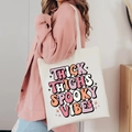 Detail of Halloween tote bag featuring retro Thick Thighs Spooky Vibes print - Thick Thighs Spooky Vibes (Boho)