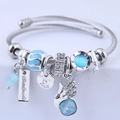 Adjustable stainless steel angel wing charm bracelet with blue opal crystal beads - Blue
