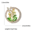 Vintage Brosche goldener Kranz mit grünen und klaren Strasssteinen für Damen - Grün