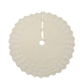 Close-up of cream knitted Christmas tree skirt with scallop wavy edge and bow ties - Ivory