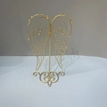 Golden angel wing jewelry display stand with multiple hooks and stable metal base - Wing Earring Stand