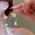 Close-up of vintage flower earrings with pink petals, green leaves and gold chains - Resin Flower Glass Bead Tassel Ear Hook (3#)