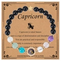 Detailed macro view of Capricorn blue sandstone beaded bracelet on thematic card display - Capricorn