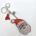 Detail of Christmas Santa hat keychain with red rhinestones and a silk tassel pendant - Smiling Santa Claus