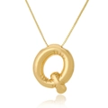 Macro shot of polished gold balloon letter Q pendant with reflective mirror finish - Letter Q / Gold