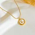 Detail of gold moon shell necklace pendant lying on soft premium silk background - White Shell Necklace B808