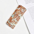 Detail of wide-tooth acetate comb with marble texture for anti-static hair styling - Turquoise Pattern