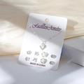 Parure collier perle en V argenté et 4 paires de boucles d'oreilles clous assorties - Carte Blanche-Collier Perle en V Argenté et 4 Paires de Boucles d'Oreilles (Étoile/Triangle/Fleur/Diamant Rond)