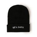Close-up of black knit beanie with 90's baby embroidery and soft ribbed acrylic texture - M (56-58cm) / Black