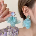 Detail of mint green silk petal earrings with shimmering iridescent stud on a model - Blue Chiffon Flower Phantom Color Bead Earrings (8#)