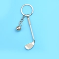 Silver metal golf club and ball keychain souvenir with polished finish on blue background - Golf Club and Ball Style (A-073)