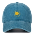 Detailed close-up of yellow sun embroidery on a washed navy cotton baseball cap - Lake Blue