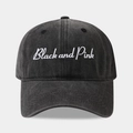 Macro detail of washed black cotton baseball cap with Black and Pink embroidery - Adjustable / Black