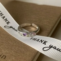 Detailed shot of open silver ring with colorful zircon hearts on gift packaging - Multicolor Zircon Wave Open Ring (J3980)