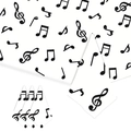 Dettaglio di tovaglioli in carta bianca con motivi di note musicali per decoro tavola - Note musicali in bianco e nero