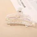 Close-up of holographic rainbow acrylic hair claw clip with large rectangular hollow design - Transparent AB Fishtail Hair Claw