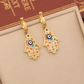 Detail of gold Hamsa hand earrings with colorful rhinestones and blue evil eye charms - 6# Palm Earrings