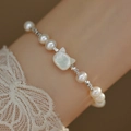 Elegant white freshwater pearl bracelet featuring a unique cat-shaped pearl centerpiece - Cat Head Shape Pearl Bracelet (I-b-029)