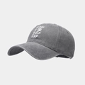 Detailed side view of washed dark gray baseball cap with white embroidery and retro texture - Adjustable / Gray