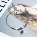 Elegant silver titanium steel bracelet with sparkling zircons and clover charm detail - Four-Leaf Clover Style / Steel