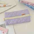 Detail of lavender quilted pencil case with diamond stitching and cream zipper closure - Light Purple