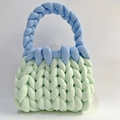 Handmade chunky knit handbag in light green with a contrasting light blue braided handle - Light Green + Dark Blue