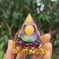 Orgone energy pyramid with amethyst, gold foil, and Om symbol held in hand - 6cm / A27-Amethyst Om Yellow Ball