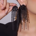 Elegant black flower tassel earrings with shimmering long fringe on a model view - 3D Flower Tassel (DTE1916140GU-BK) / Black